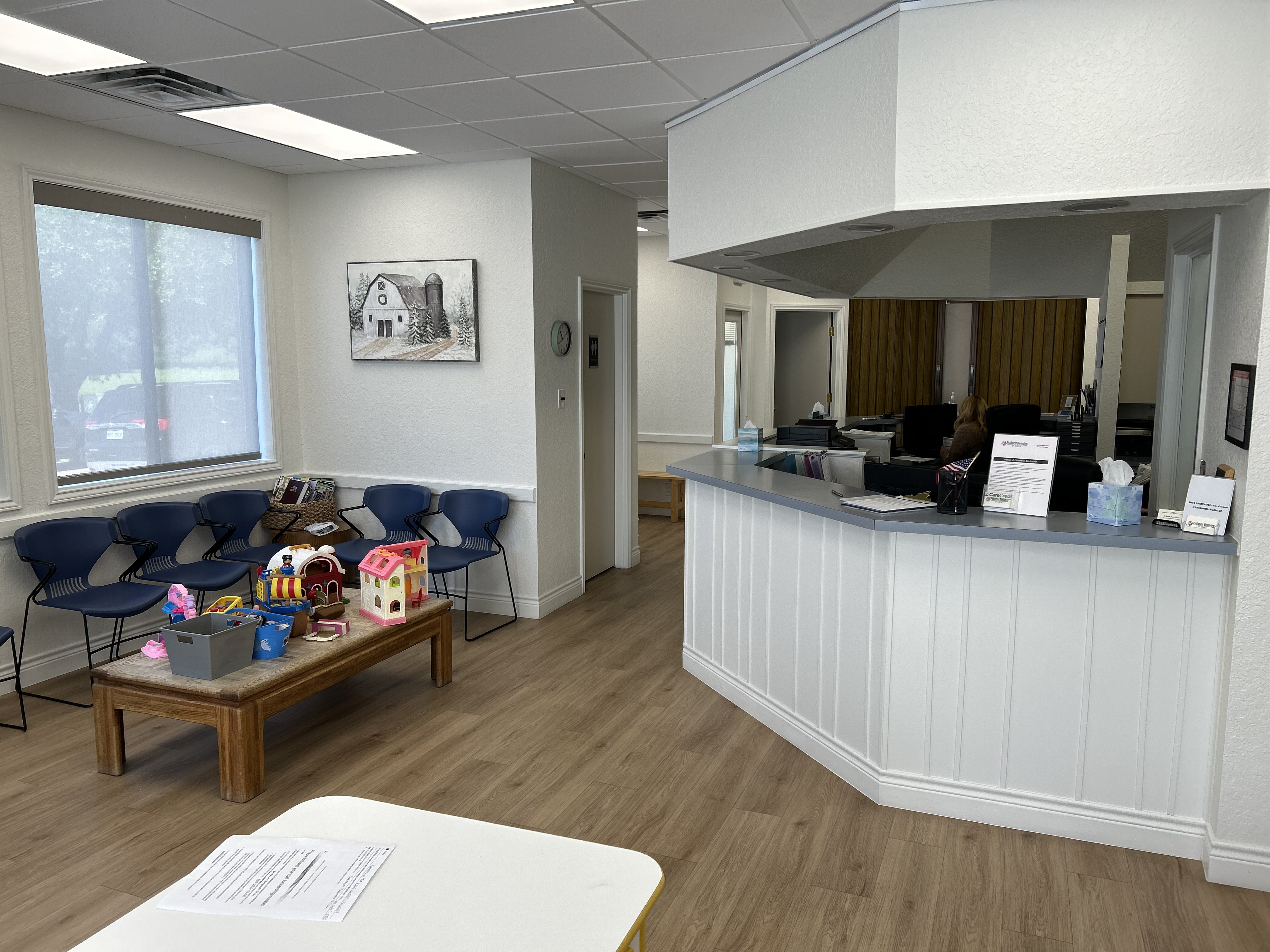 Child-friendly waiting room with toys and front desk at Pediatric Dentistry of Temple, Texas